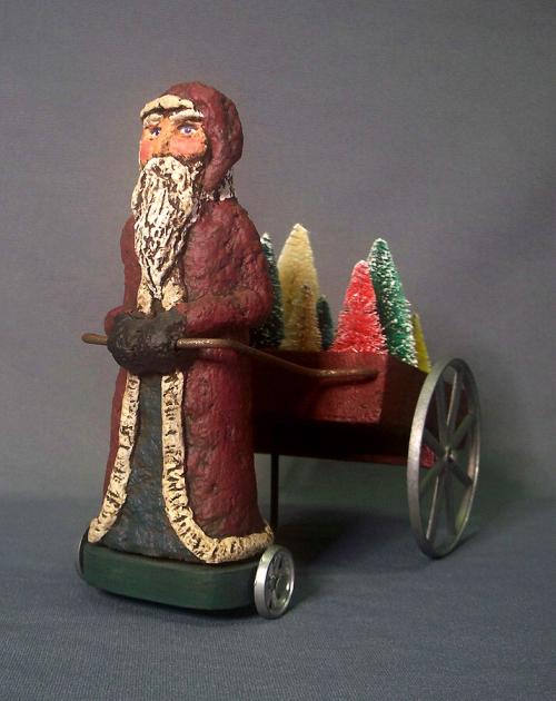 Paper Mache Santa Claus Pulling A Cart Of Trees